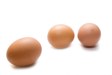 three eggs on the white isolated background