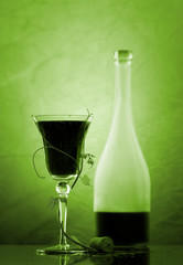 red wine glass and bottle