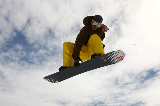 Jumping Snowboarder