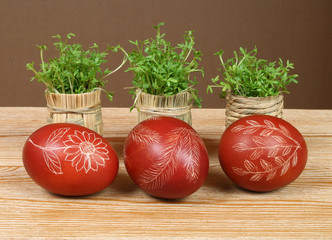 Ornate, traditional decorated Easter eggs and green cress