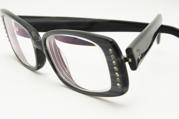 Black eyeglasses on white background