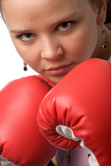 serious woman in red boxing gloves