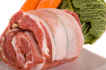 Rolled Raw Stuffed Breast of Lamb and Vegetables