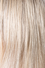 Blond woman hair texture or background.