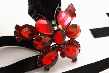 Red butterfly with black ribbon
