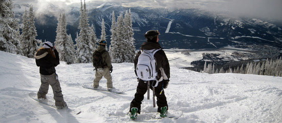 snowboarders on high mountain