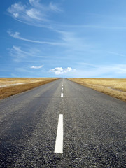 country highway with a beautiful blue sky