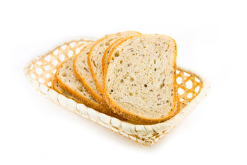 Fresh baked bread sliced in the basket 