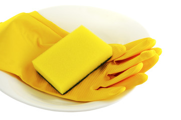 sponge  plate and economic gloves on white background 