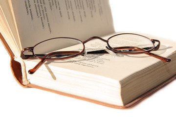 Small glasses on book
