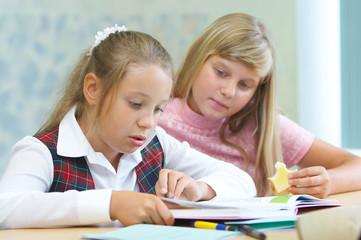 girls doing homework together