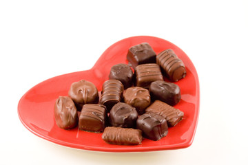 Chocolates on a heart shaped plate.