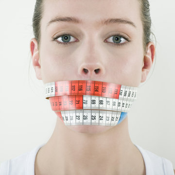 Young Beautiful Caucasian Woman Gag By A Meter Ribbon