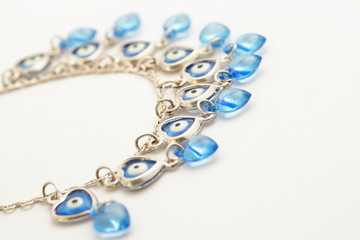 Blue necklace on white