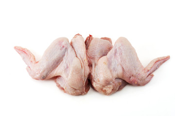 Two raw chicken wings on white background