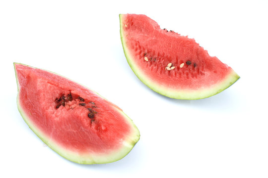 On a photo two pieces of a water-melon. 