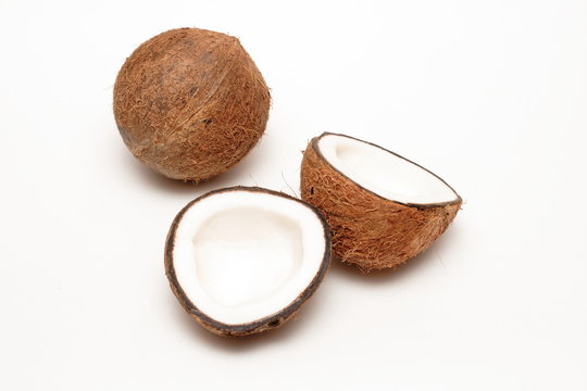 one cracked  and one unbroken coconuts