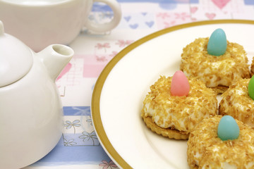 Teatime with coconut cakes decorated with small Easter eggs