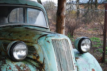 Antique rusted car front view 