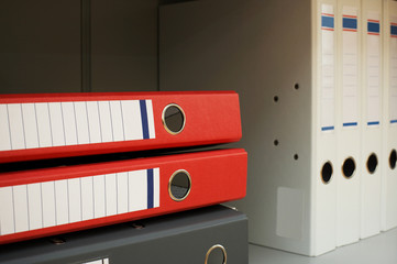 Modern folders for a paper on a book shelf