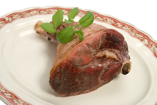 Roast Half Leg Of Lamb With Mint On A Platter