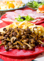 Holiday supper. Potatoes and mushrooms in the foreground.