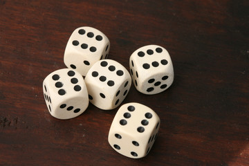 playing with several white dices on various backgrounds..