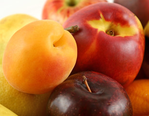 Basket filled with freshly picked colorful organic fruit.