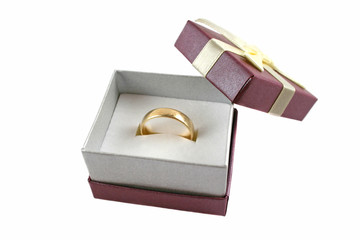 Gold wedding band set in a ring gift box.