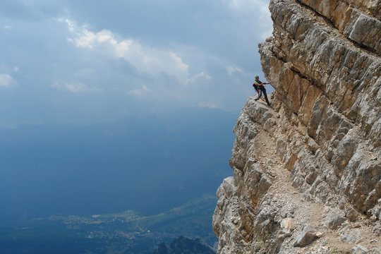 Sport - woman climbing in Dolomites