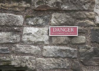 Danger Sign on Historic Old Building