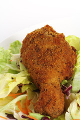 southern fried chicken drumstick on salad plate