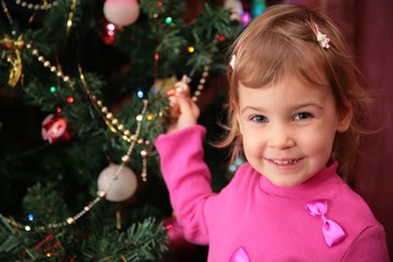 little girl and christmas fir 2