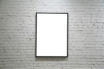 one black frame on white brick wall