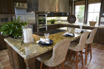 Modern designer kitchen with brown tiles.