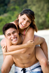 Fototapeta premium couple by the beach having fun