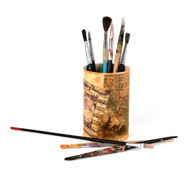 Watercolor brushes in tin can