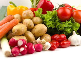 row of fresh vegetables on white