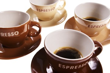 four cups of espresso isolated on white