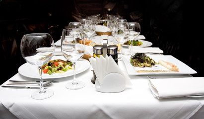 Serving of table in a restaurant from glasses