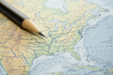 Fototapeta na wymiar black pencil over modern map of russia