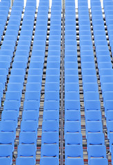 Naklejka premium Rows of blue plastic chairs