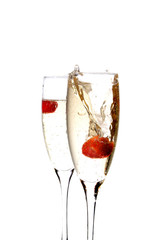 Glass of champagne with strawberry inside