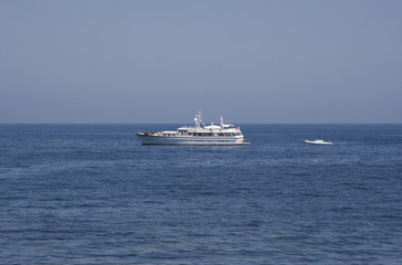 Fototapeta na wymiar luxury yacht pulling a lifeboat