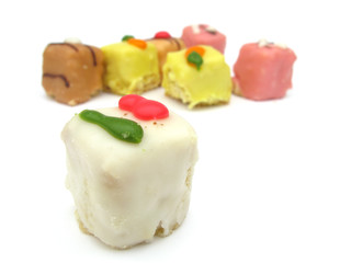 Cakes fancy white, yellow, pink and brown