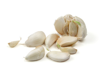 Broken bub of garlic with cloves isolated on white background