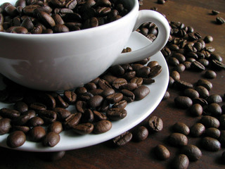 White cup with coffee beans