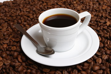 Cup with coffee, costing on coffee grain