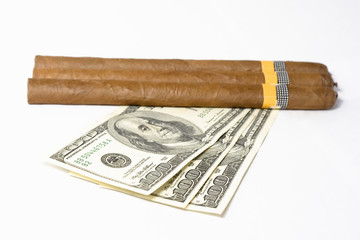 Cuban Tobacco and US dollars isolated on white