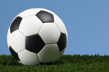 Football - Soccer ball against blue sky